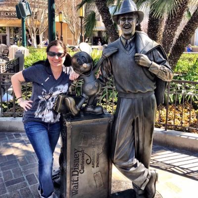 Posing with the Walt Disney statue at Disney's California Adventure