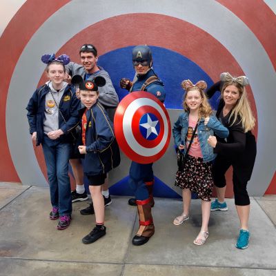 Posing for a picture with Captain America. My whole family and I are huge Marvel fans. 