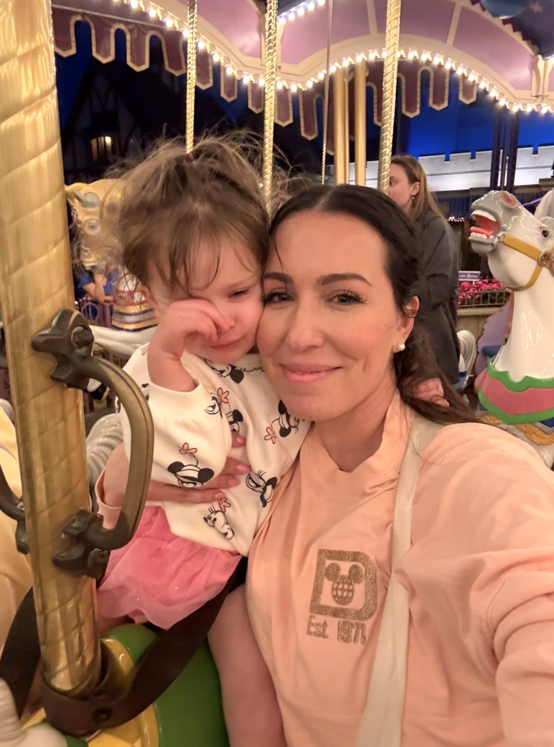 Riding Prince Charming Carousel at Magic Kingdom with Toddler