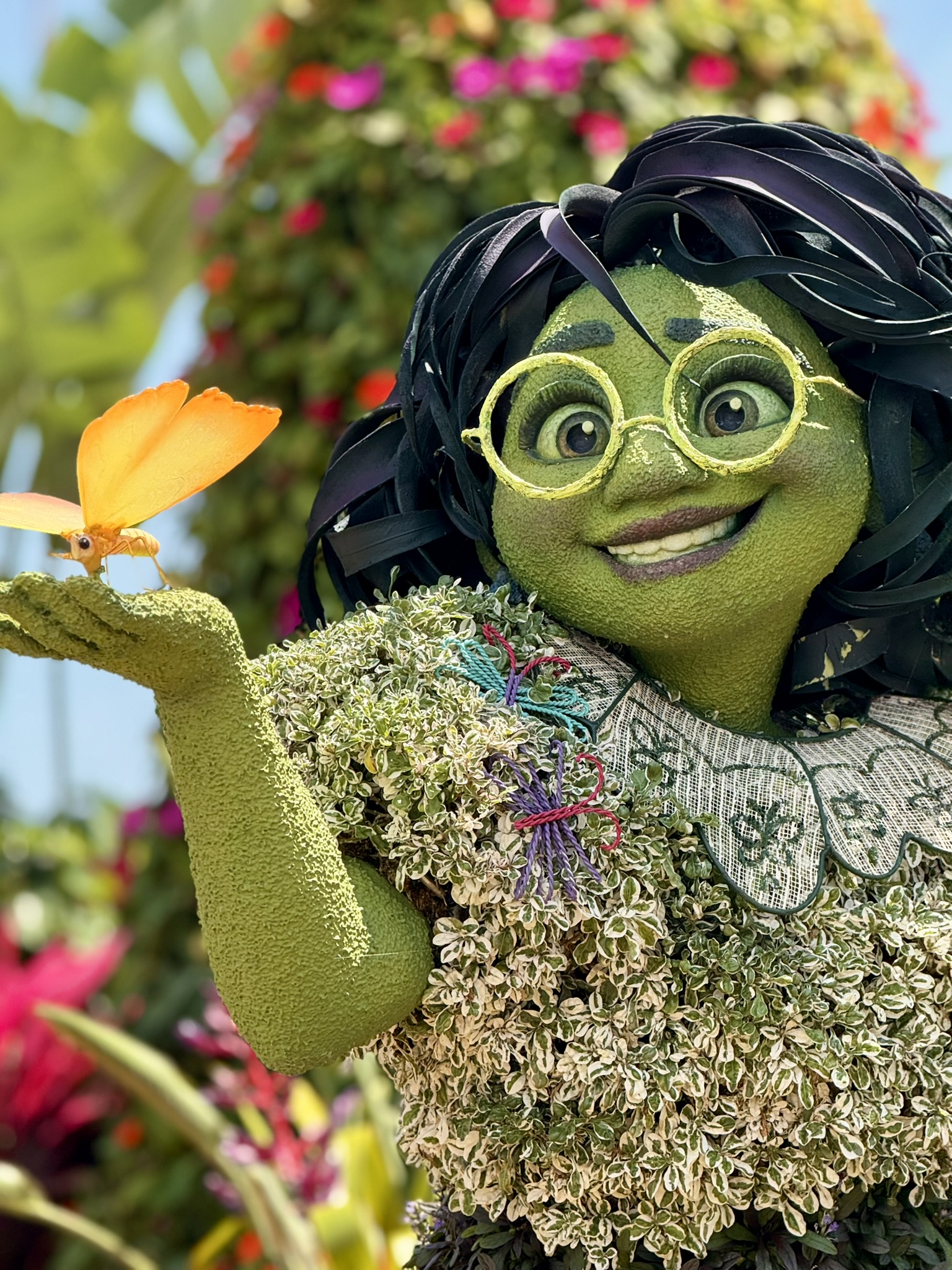 Mirabel topiary at the EPCOT International Flower & Garden Festival with colourful flowers in the background