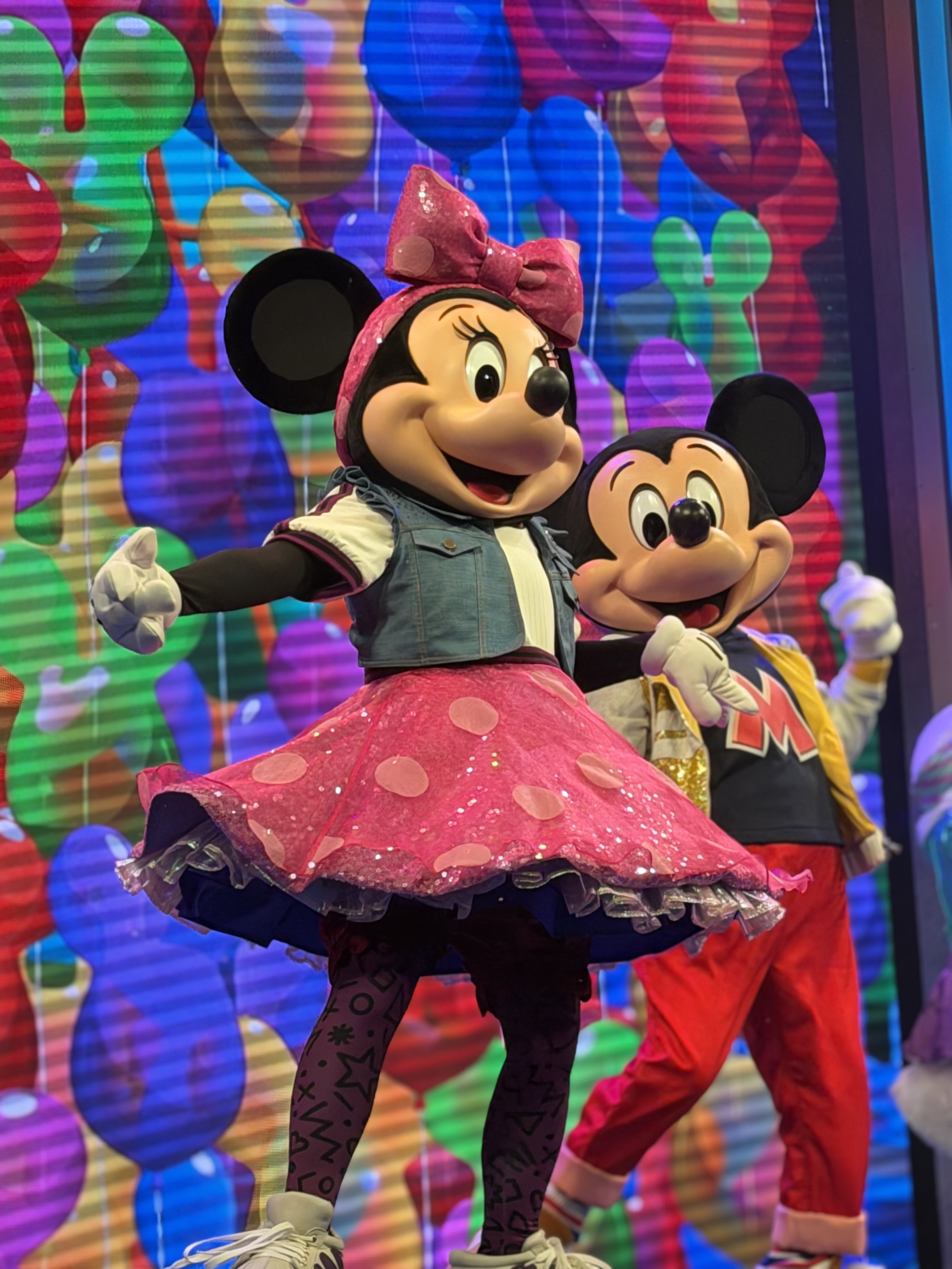Mickey Mouse and Minnie Mouse dancing on stage...