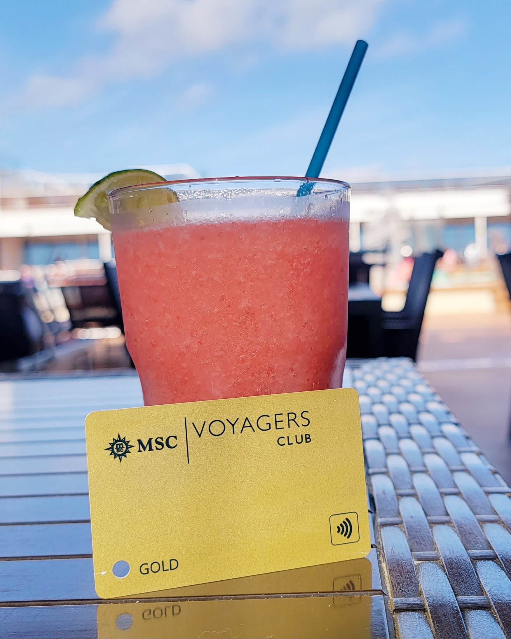 MSC Voyagers Club Gold card displayed beside a frozen drink on an MSC cruise ship.